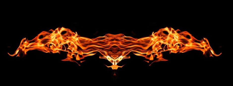Decorative background with fire flames on black with copy space