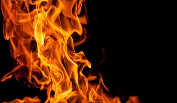 Decorative background with fire flames on black with copy space