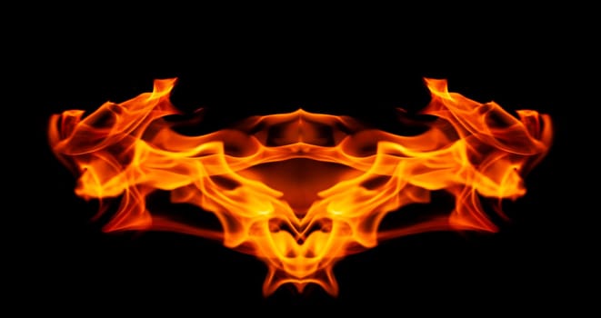 Decorative background with fire flames on black with copy space