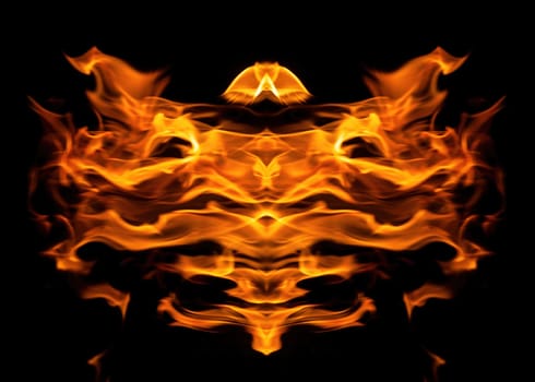 Decorative background with fire flames on black with copy space