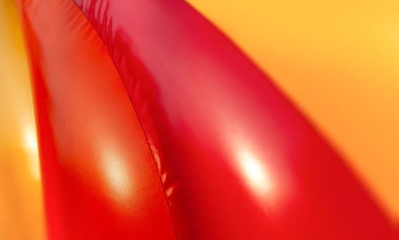 Abstract background and texture of a bright colourful plastic playground for playtime