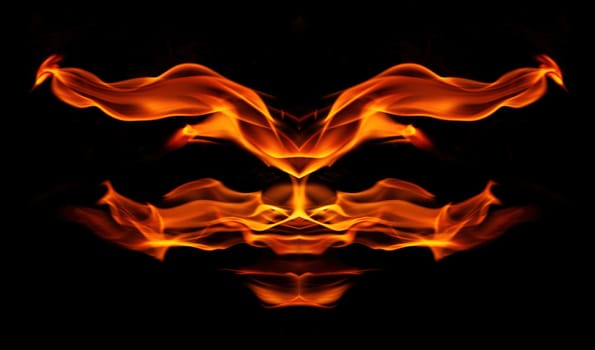 Decorative background with fire flames on black with copy space