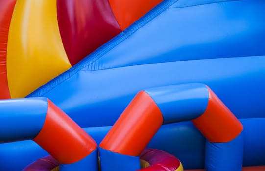 Abstract background and texture of a bright colourful plastic playground for playtime