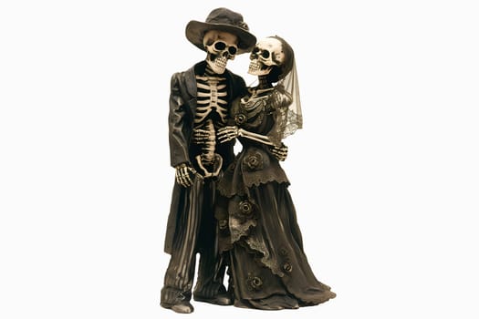 A couple of skeletons dressed in black and white clothing are holding hands cut out