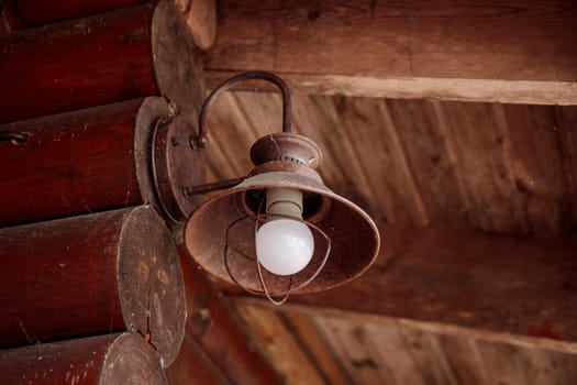 The old kerosene lamp on a wooden floor, old gray cement backdrop, banner with copyspace