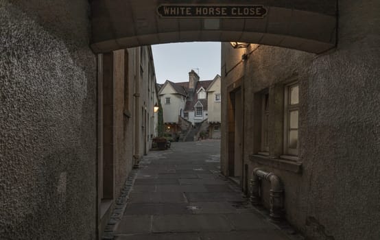 Edinburgh, Scotland - Jan 17, 2024 - Perspective view of the alleyways into the famous "White Horse Close" on Royal Mile in the Old Town of Edinburgh city. It was formerly known as "Ord's Close", Space for text, Selective focus.