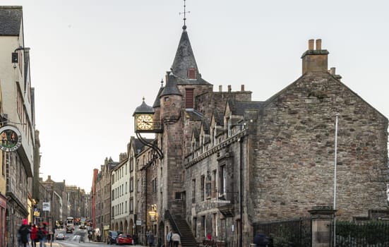 Edinburgh, Scotland - Jan 17, 2024 - Clock tower of the famous Canongate Tolbooth (The Tolbooth Tavern) is a historic landmark on Royal Mile in the Old Town of Edinburgh city. Space for text, Selective focus.
