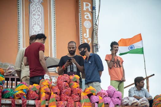 Jaipur, India - 15th Aug 2023 : people standing in front of Indian tricolor flag mounted showing national pride and celebration of independence and republic day