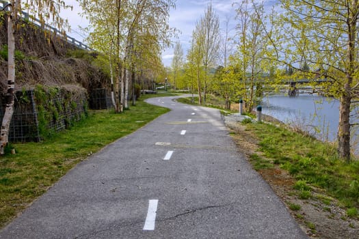 A bike and walking path in a park like setting in the downtown area of Sandpoint, Idaho.