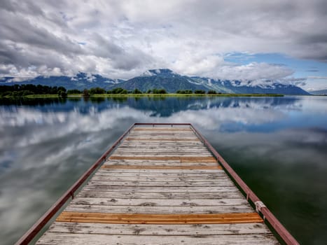 A floating dock on a calm section of Pend Oreille Lake just south east of Sandpoint, Idaho.