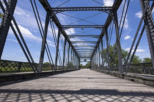 The old Wells Street Bridge on a bright day in downtown Fort Wayne, Indiana.