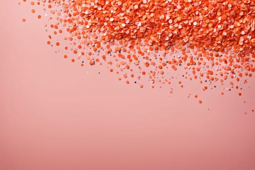 A close-up view of a surface covered in peach and silver confetti. The confetti is scattered randomly, creating a textured and sparkling background. The soft light catches the confetti, making it shimmer and shine.