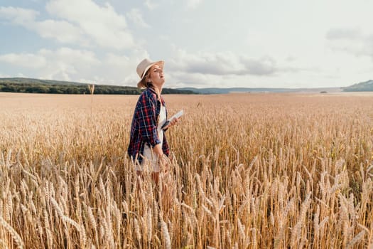 A young woman walks through a field of wheat on a sunny day, wearing a straw hat, plaid shirt and a white dress. The sun illuminates the wheat field in golden hues creating a warm and inviting atmosphere.