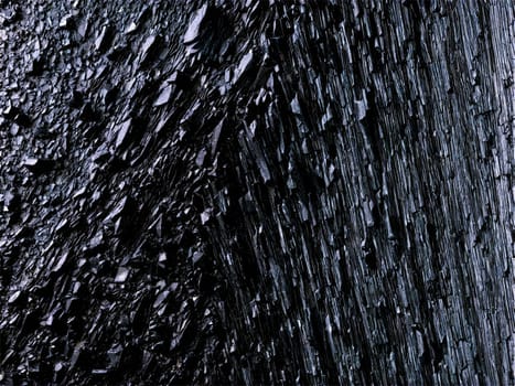 Stone isolated on transparent background. Argillite A dark argillite with a smooth slate like texture floating and lit to show.