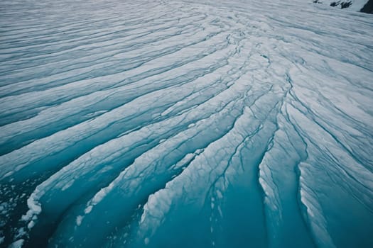 The image captures the cold and natural beauty of a glacier, with its textured surface ranging from shades of white to deep blue, forming striking patterns and contrasting against the smoothness of the water.