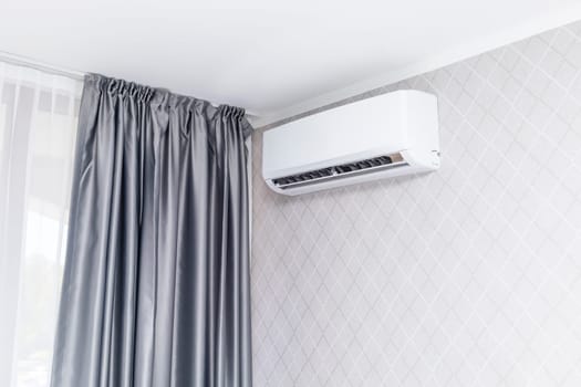 White Air Conditioner Mounted On Wall Decorated With Wall Paper Inside The Condo, House or Hotel. Hvac System. Smart Air Conditioning Blowing Cold Air In The Room For Home. Horizontal. High quality.