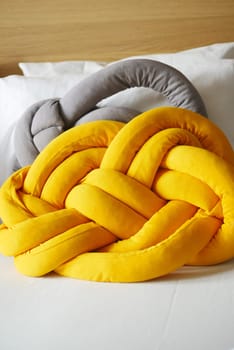 colorful pillow on white bed .