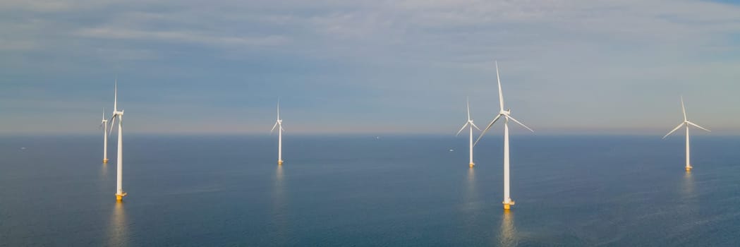 A photo of an offshore wind farm with turbines in the ocean in the Netherlands