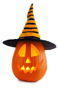 Jack O Lantern Halloween funny pumpkin with carved smiling face with witches hat isolated on white background