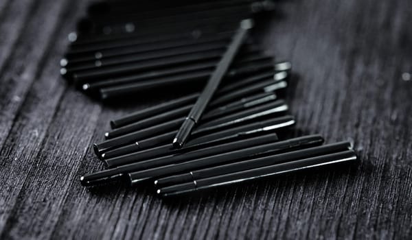 nibs for drawing tablet pen on a dark table, close up view