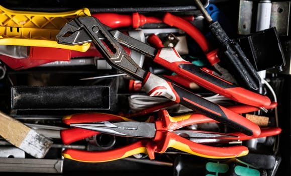 Adjustable wrench or tongue-and-groove pliers and other work tools service and repairment. Repair equipment for manual repair