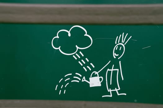 Drawing of a boy watering flowers from a watering can