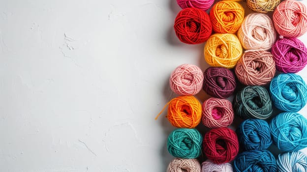 Colorful yarn rolls are neatly arranged in a grid formation, providing a vibrant backdrop with ample space for adding creative text or designs.