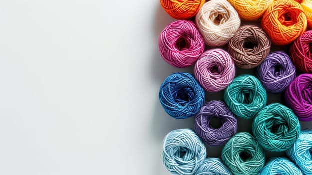 Colorful yarn rolls are neatly arranged in a grid style, showcasing vibrant hues against a clean white background, perfect for text overlay and crafting inspiration.