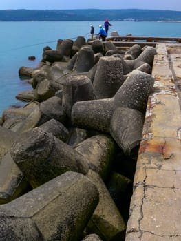 BULGARIA, VARNA - JUNE 06, 2013: coast protection structures, pier and concrete tetrahedrons for storm protection and pier destruction, Bulgaria