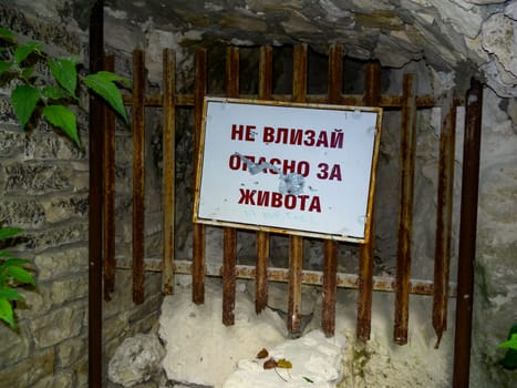 BULGARIA, VARNA - JUNE 06, 2013: information board - DON'T GET IN, DANGEROUS TO LIFE- near the underground museum of historical catacombs in Bulgaria 