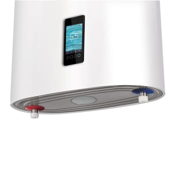 Close-up household smart water heater hanging on the wall in boiler room. Modern tanked boiler in bathroom. Common electric storage tank water heater. Energy-efficient home heating system on white