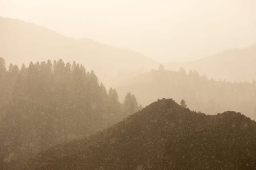 fog covered mountains during a rain storm