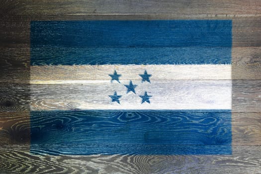 A Honduras flag on rustic old wood surface background