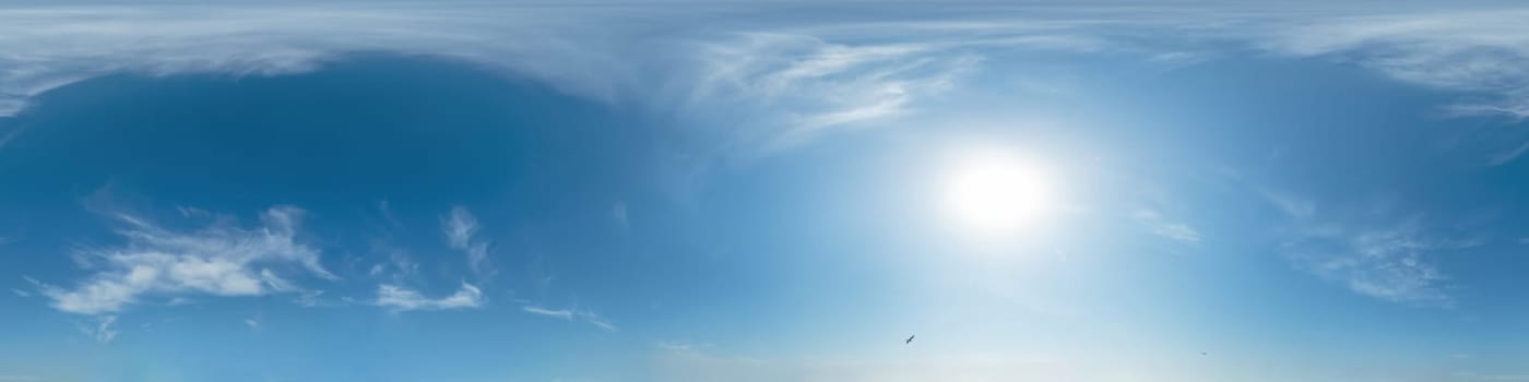 Bright sunset sky panorama with Cirrus clouds. Seamless hdr spherical equirectangular 360 panorama. Sky dome or zenith for 3D visualization, game and sky replacement for aerial drone 360 panoramas.