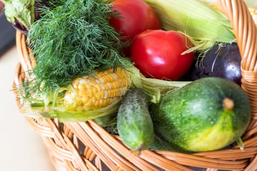 Close up shot of fresh vegetables and herbs in the basket