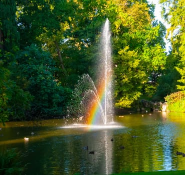 NANTES, FRANCE - SEPTEMBER 12, 2017: Rainbow in the fountain. The Botanical Garden is located across the street from Nantes Railway Station