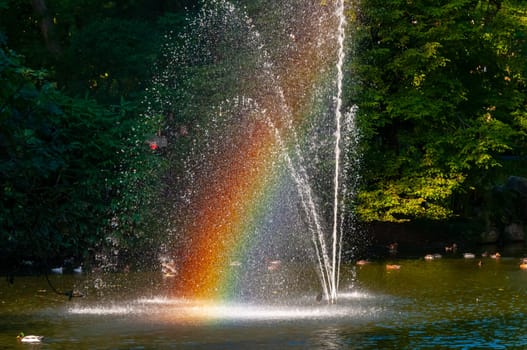 NANTES, FRANCE - SEPTEMBER 12, 2017: Rainbow in the fountain. The Botanical Garden is located across the street from Nantes Railway Station