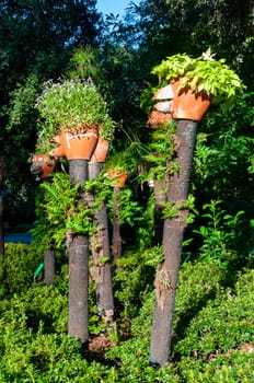 NANTES, FRANCE - SEPTEMBER 12, 2017:  Landscape park design, potted flowers on poles in a city park in Nantes, France