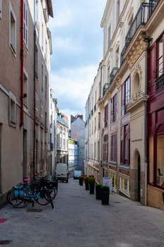 NANTES, FRANCE - SEPTEMBER 12, 2017: cityscape, cobblestone streets among old houses in downtown Nantes, France