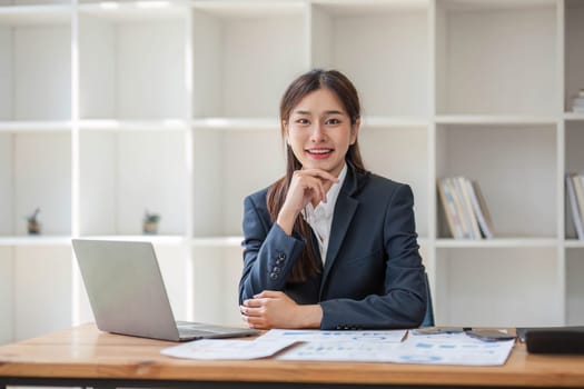 Portrait of accountant woman working on financial strategy as growth at startup company with smile..