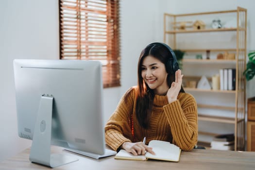 Beautiful young teen asian business woman meeting at on computer laptop with planning working on financial document, tax, exchange, accounting and Financial advisor.