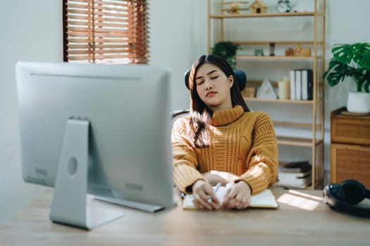 Portrait of business owner, woman using computer and financial statements Anxious expression on expanding the market to increase the ability to invest in business.