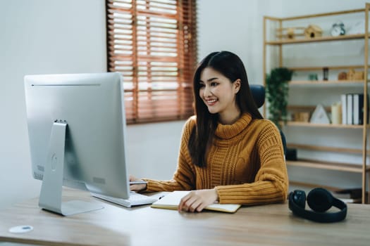 Beautiful young teen asian business woman meeting at on computer laptop with planning working on financial document, tax, exchange, accounting and Financial advisor.