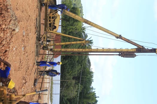 ilheus, bahia, brazil - may 23, 2022: pile driving equipment during foundations in a construction in the city of Ilheus.