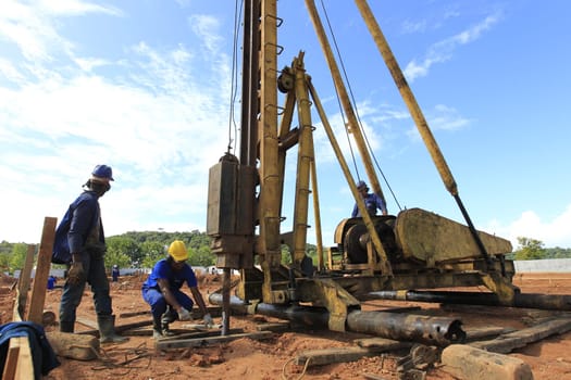 ilheus, bahia, brazil - may 23, 2022: pile driving equipment during foundations in a construction in the city of Ilheus.