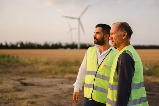 Engineer working with confident. Worker outdoor working. Renewable energy from wind and solar.