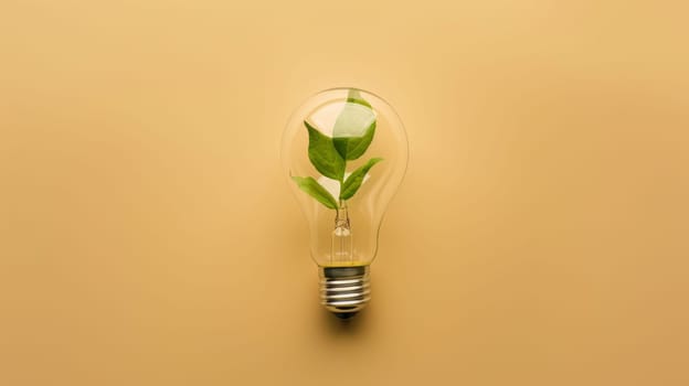 Light bulb with green plant inside on beige background, sustainability and eco-friendly concept.