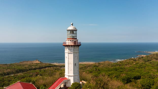 Aerial view of lighthouse on hill. Cape Bojeador Lighthouse, Ilocos Norte, Philippines.