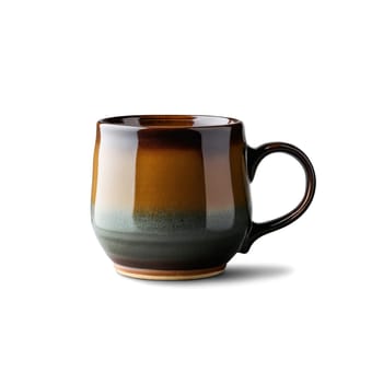 Rustic wood fired ceramic mug with a natural ash glaze filled with a rich dark. Drink isolated on transparent background