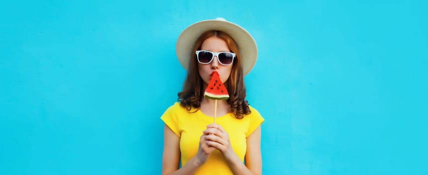 Summer portrait of stylish young woman with juicy lollipop or ice cream shaped slice of watermelon